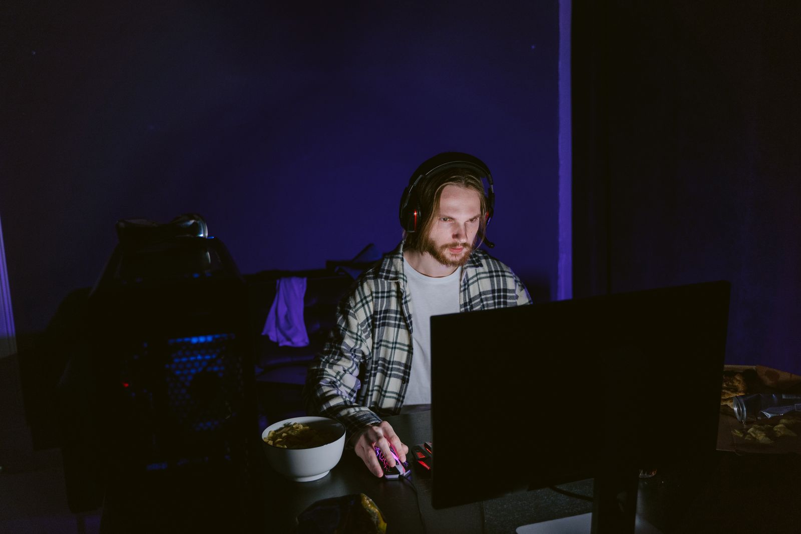 Player at a computer at night with a headset, playing ranked matches in Gods Unchained