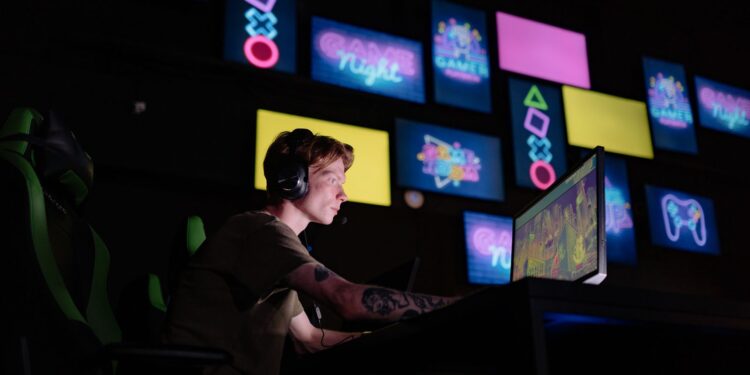 Gamer playing a web3 game on a PC in a neon-lit room