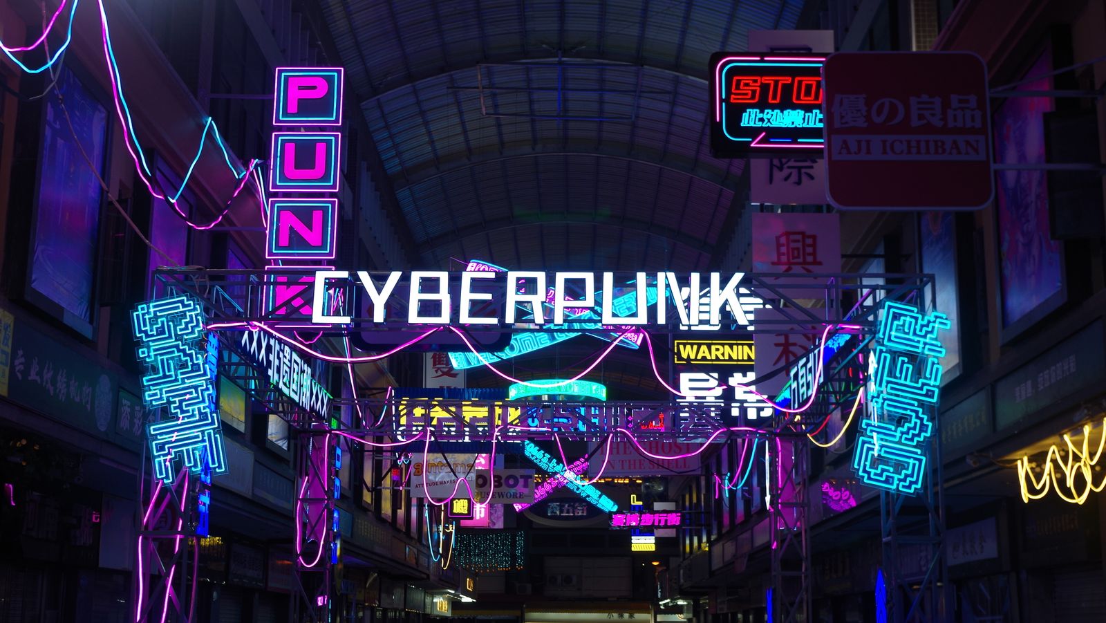 Cyberpunk city street at night with neon signs reflected on wet ground